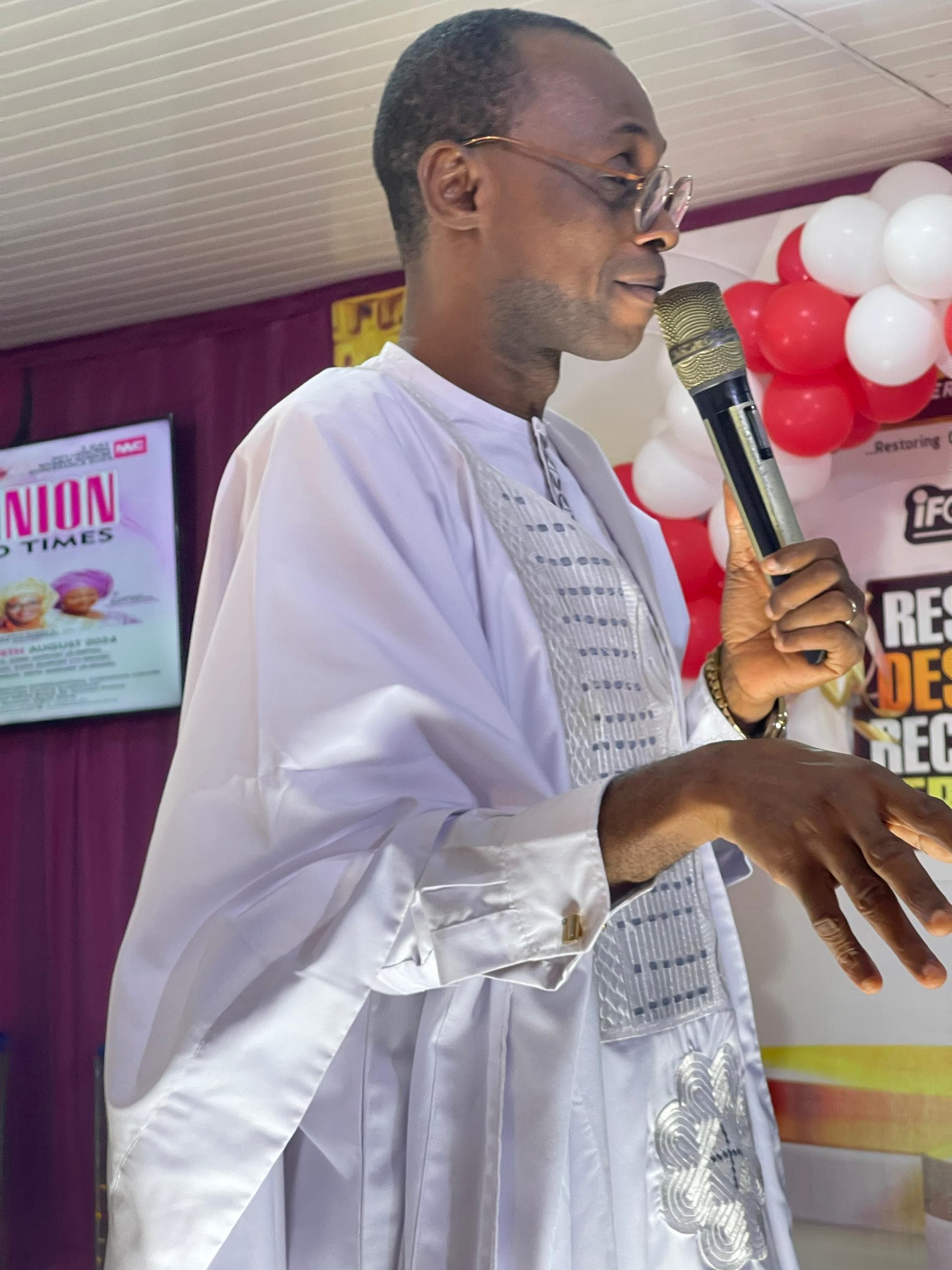 Bishop Jide Olayinka Ayangbesan speaking during a church gathering.